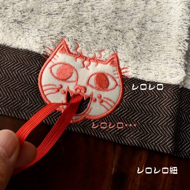 ピーチ顔のミミケルレロレロ紐付き今治タオル