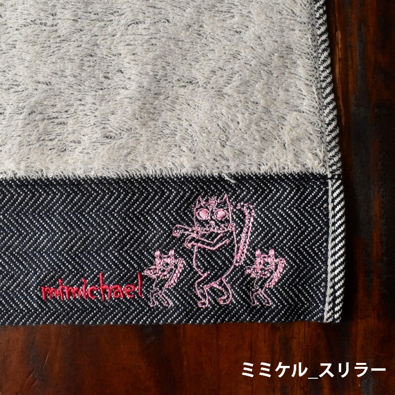 ピンク顔のミミケルレロレロ紐付き今治タオル